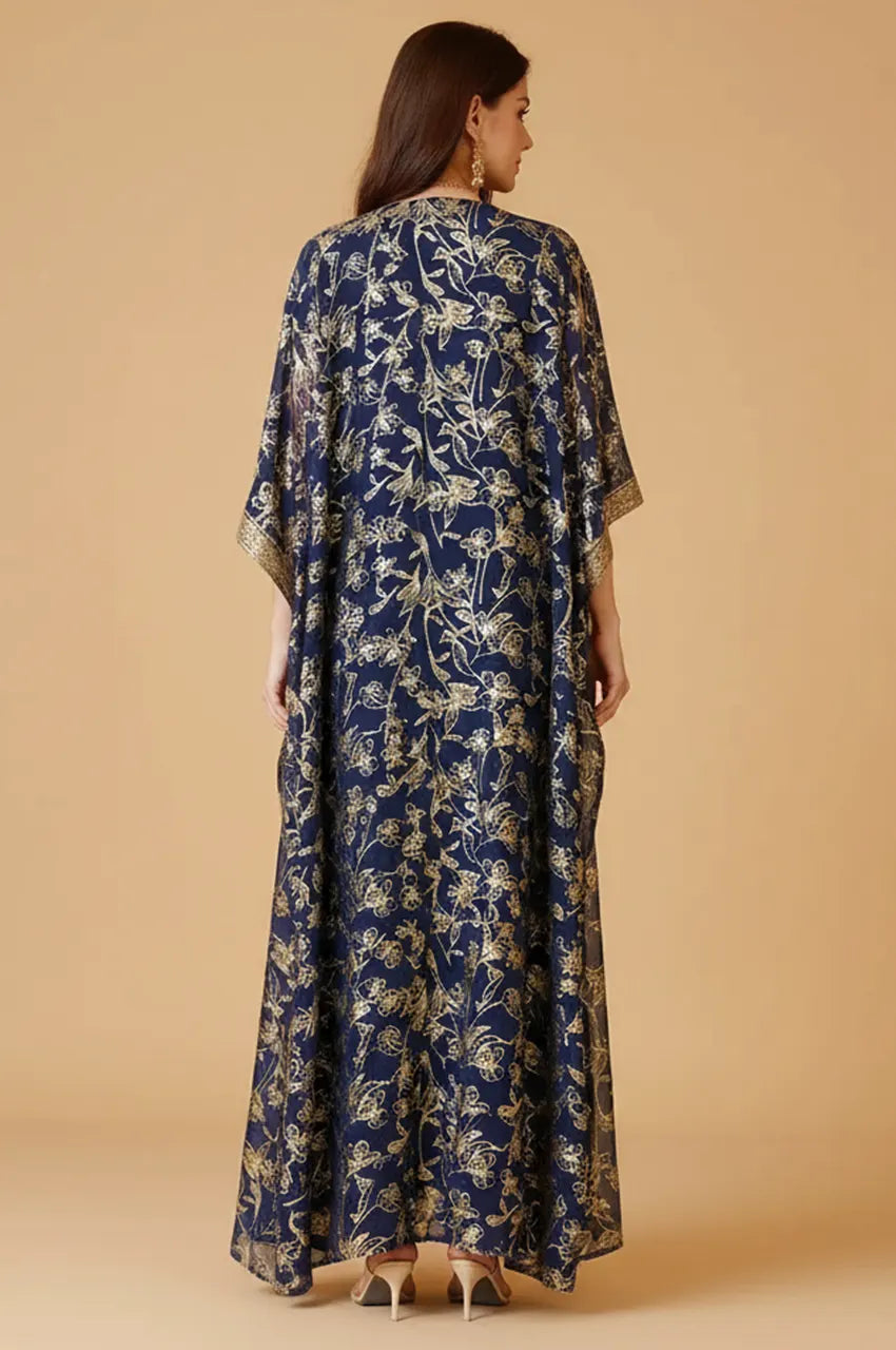 Back view of Aziri navy butterfly kaftan showing full-length gold floral foil print.