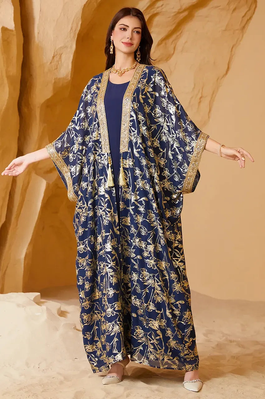 Lifestyle view of the navy long open kaftan styled for a formal evening soiree or Eid gathering.