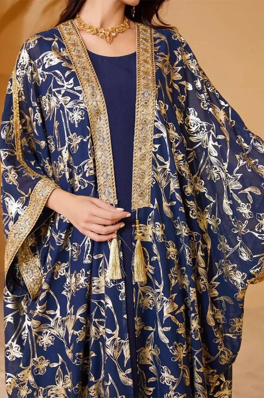 Close-up of the gold embroidered round neckline on the navy long open kaftan.