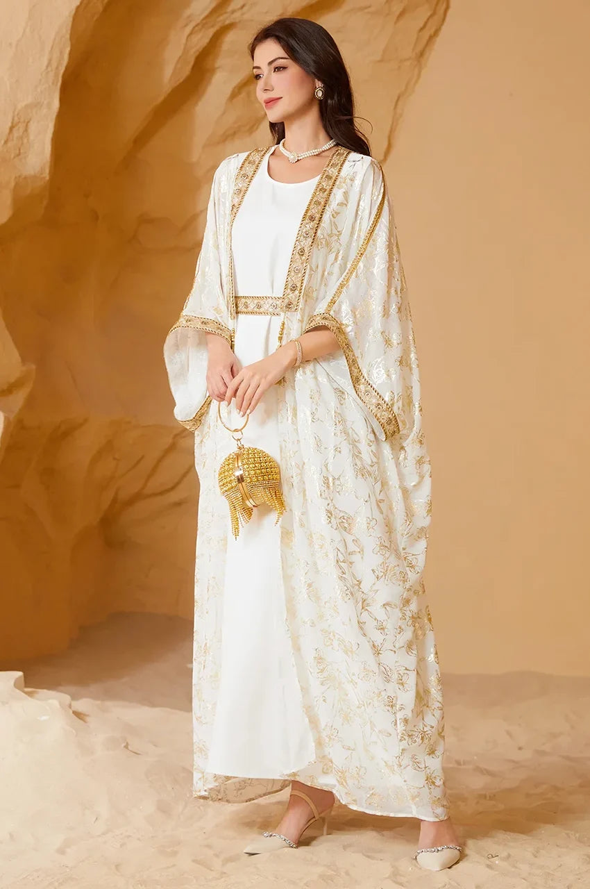 AZIRI white long open kaftan styled with the detachable tassel belt for a defined waist silhouette.