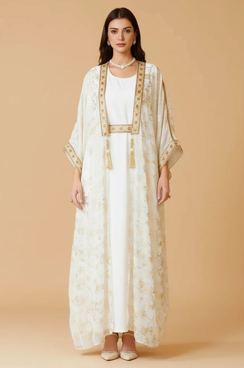 Full front view of the AZIRI white long open kaftan featuring gold floral foil motifs and butterfly sleeves.