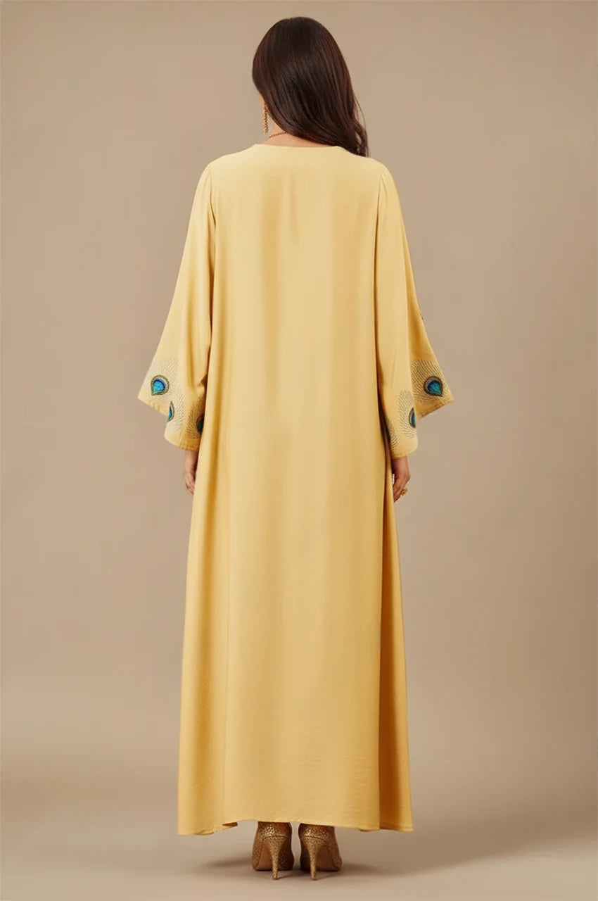 Back view of Azura Yellow Peacock Kaftan with flowing golden fabric