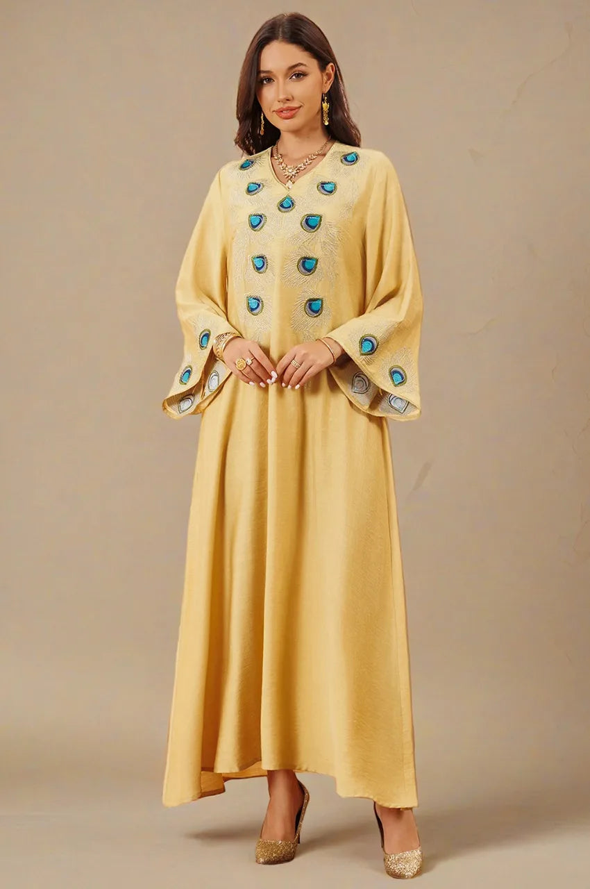 Angled front studio shot of Azura Yellow Peacock Kaftan with embroidery details