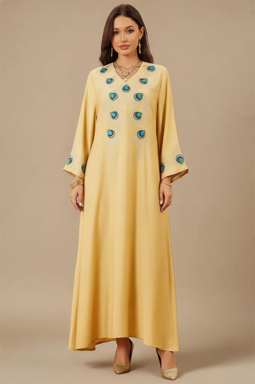 Azura Yellow Peacock Kaftan front view with blue embroidered peacock feathers