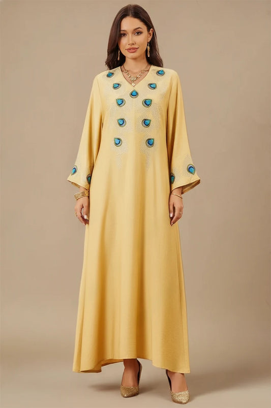 Azura Yellow Peacock Kaftan front view with blue embroidered peacock feathers