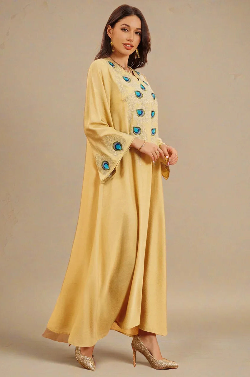 Side profile of Azura Yellow Peacock Kaftan showcasing sleeve embroidery