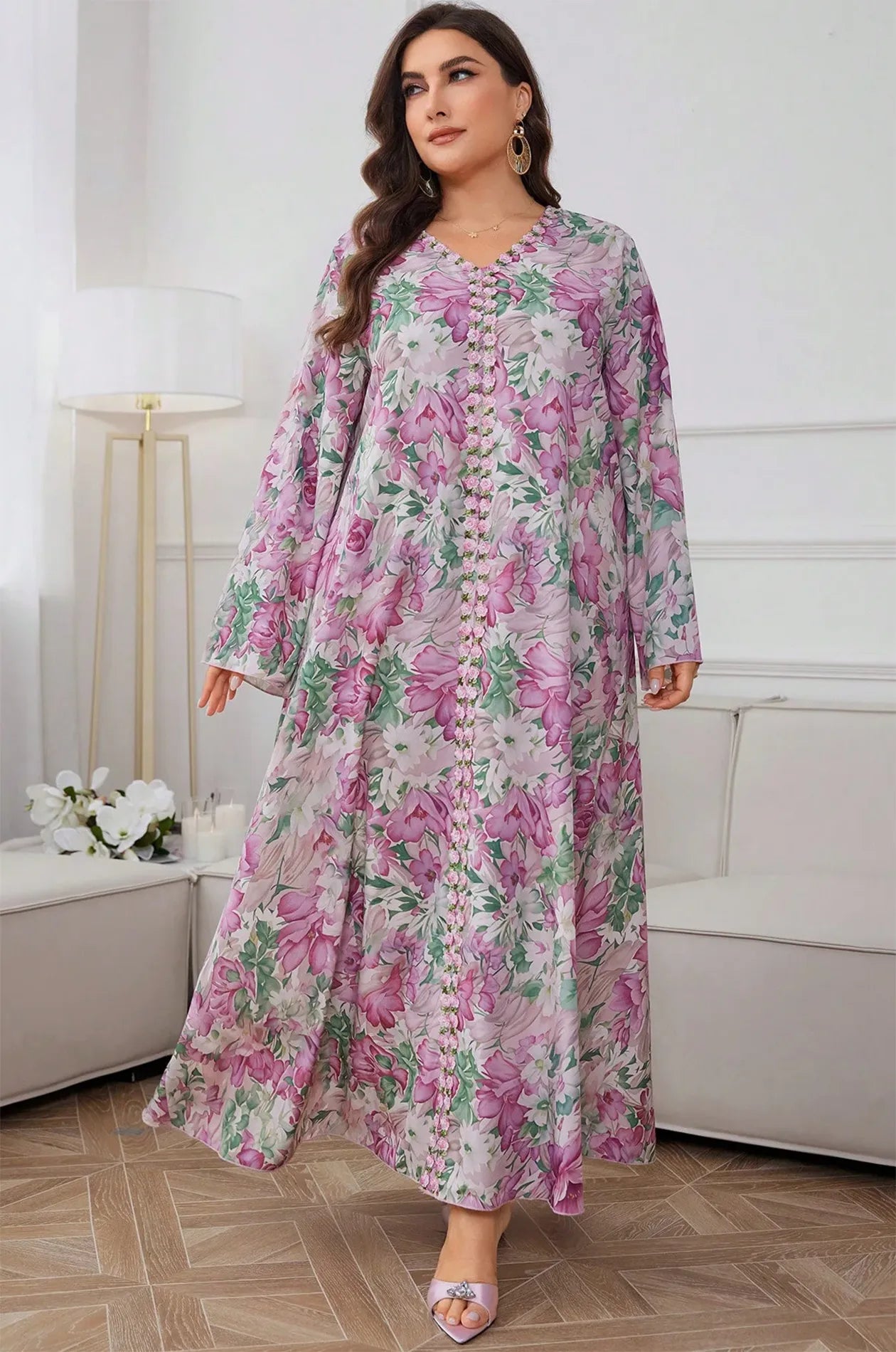 Close-up of the intricate floral beaded trim on the Suri light pink kaftan.