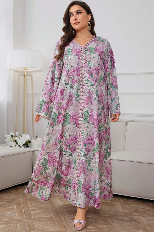 Close-up of the intricate floral beaded trim on the Suri light pink kaftan.