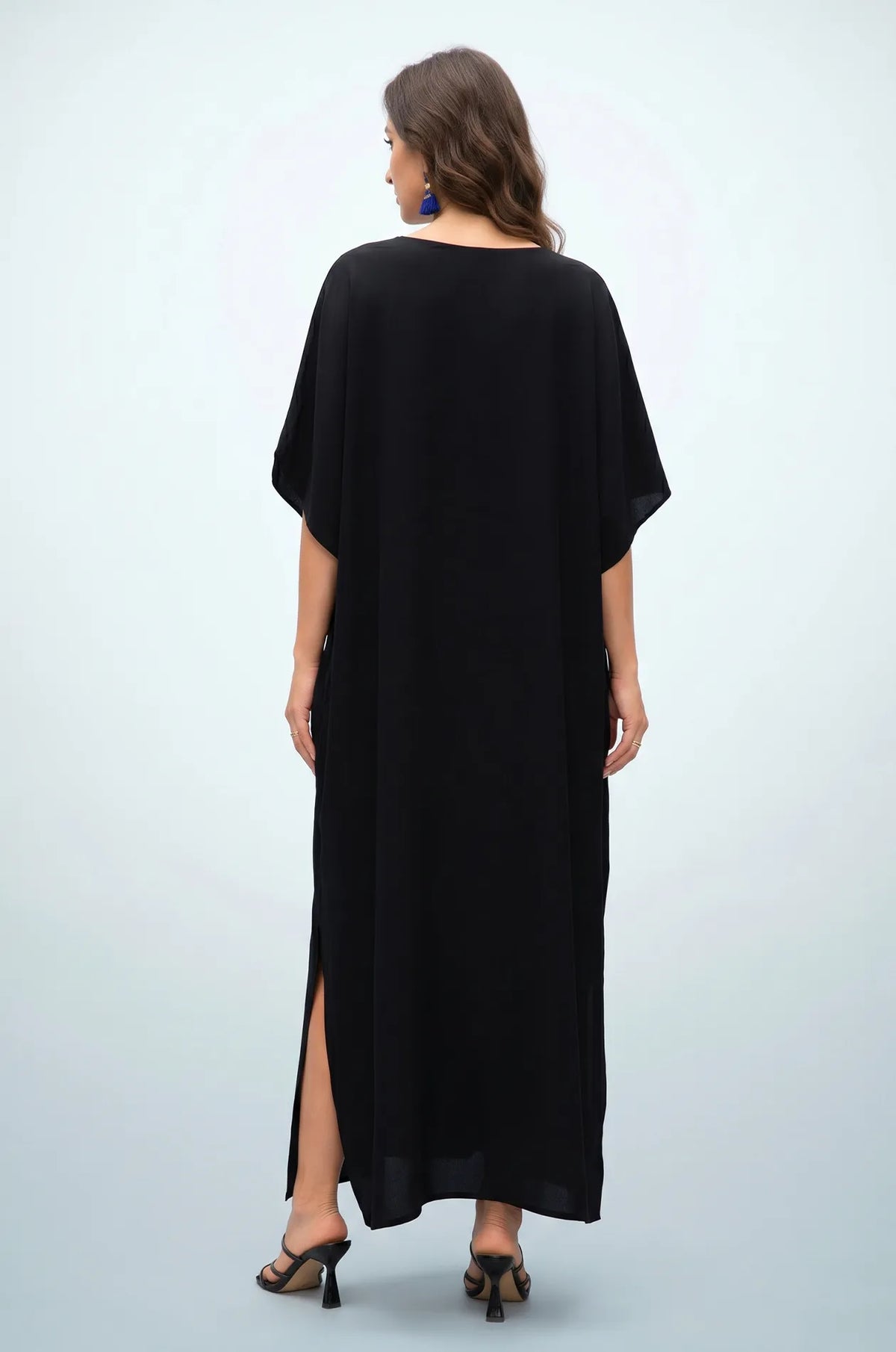 Back view of plain black maxi kaftan with side slit