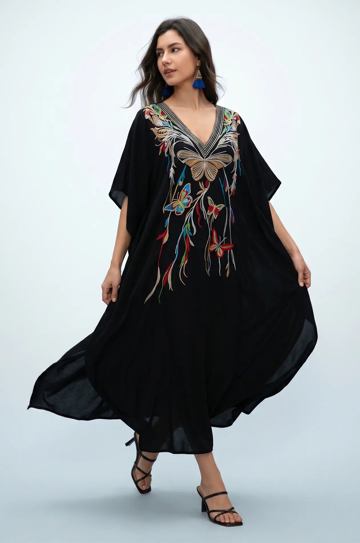 Black beach kaftan in motion with multicolor butterfly embroidery