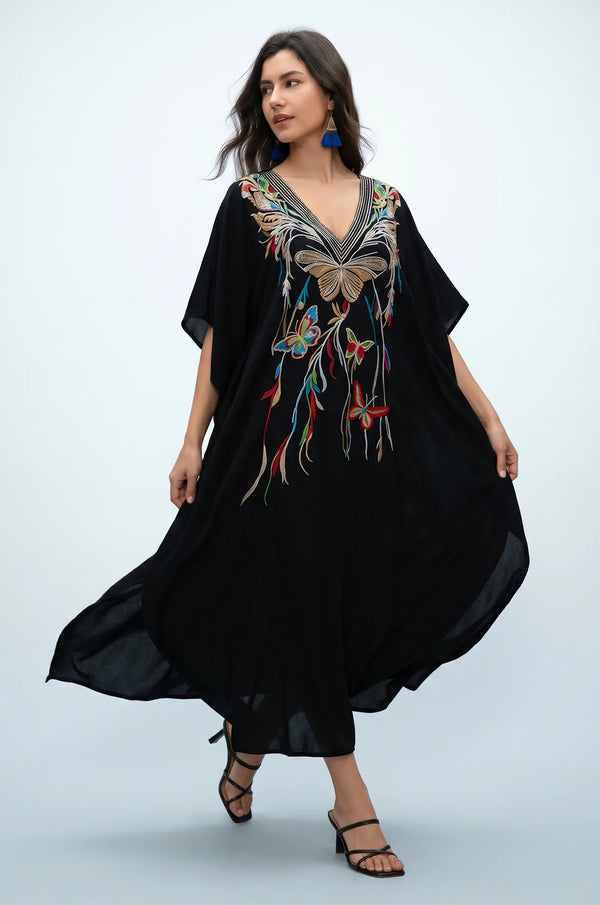 Black beach kaftan in motion with multicolor butterfly embroidery