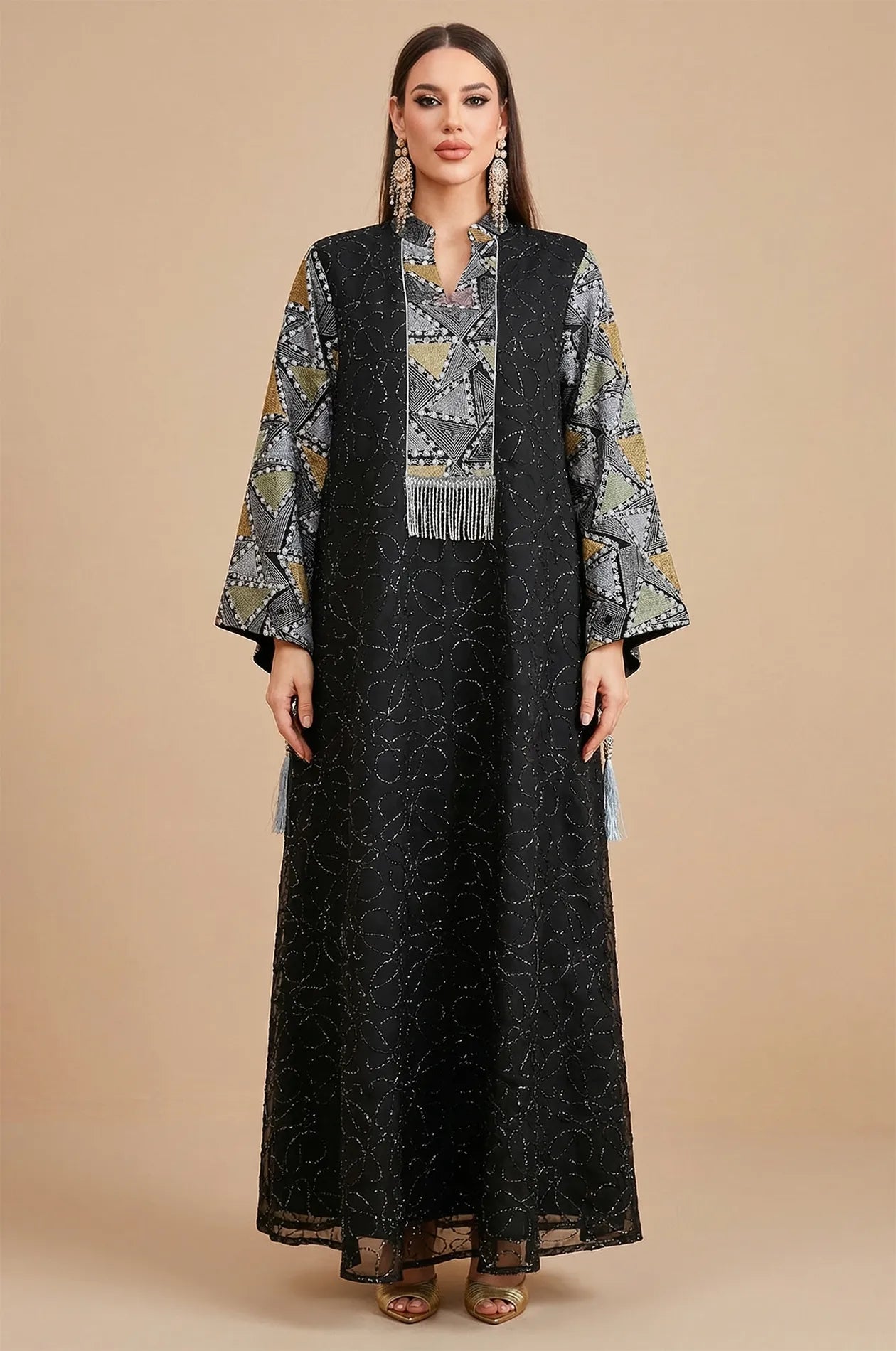 Full front view of the Black Kaliera geometric kaftan by Naylara, featuring metallic gold embroidery and intricate triangle patterns.