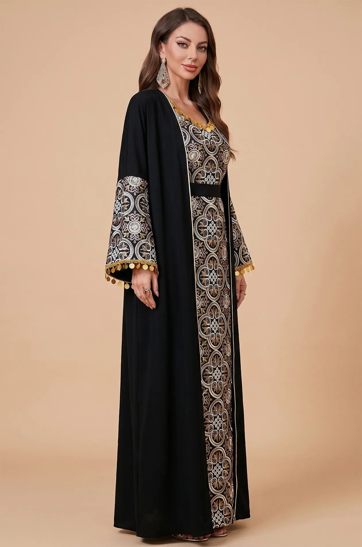 A three-quarter profile of the Black Novae crepe kaftan showing the bell sleeve silhouette and metallic embroidery accents.