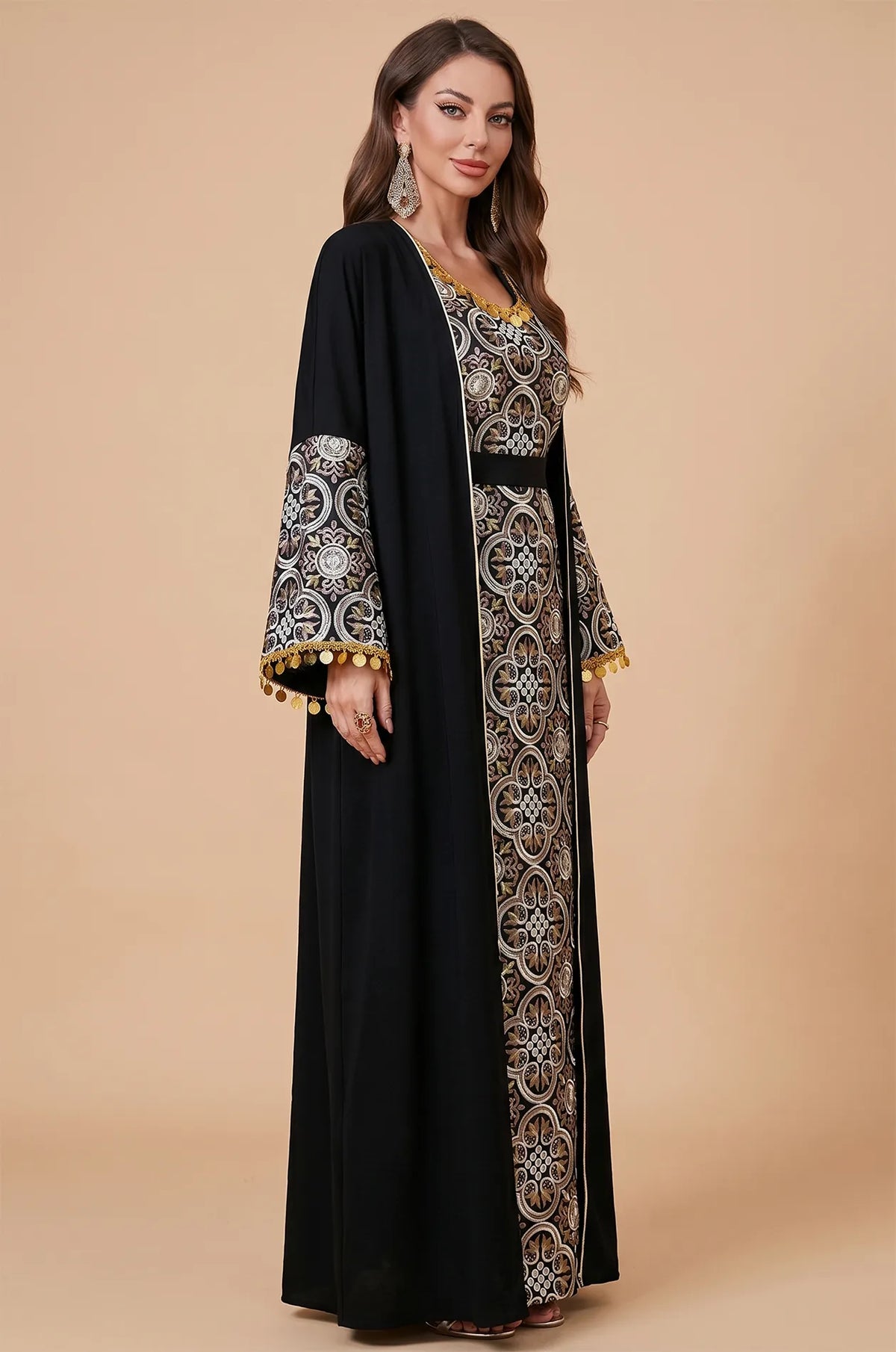 A three-quarter profile of the Black Novae crepe kaftan showing the bell sleeve silhouette and metallic embroidery accents.
