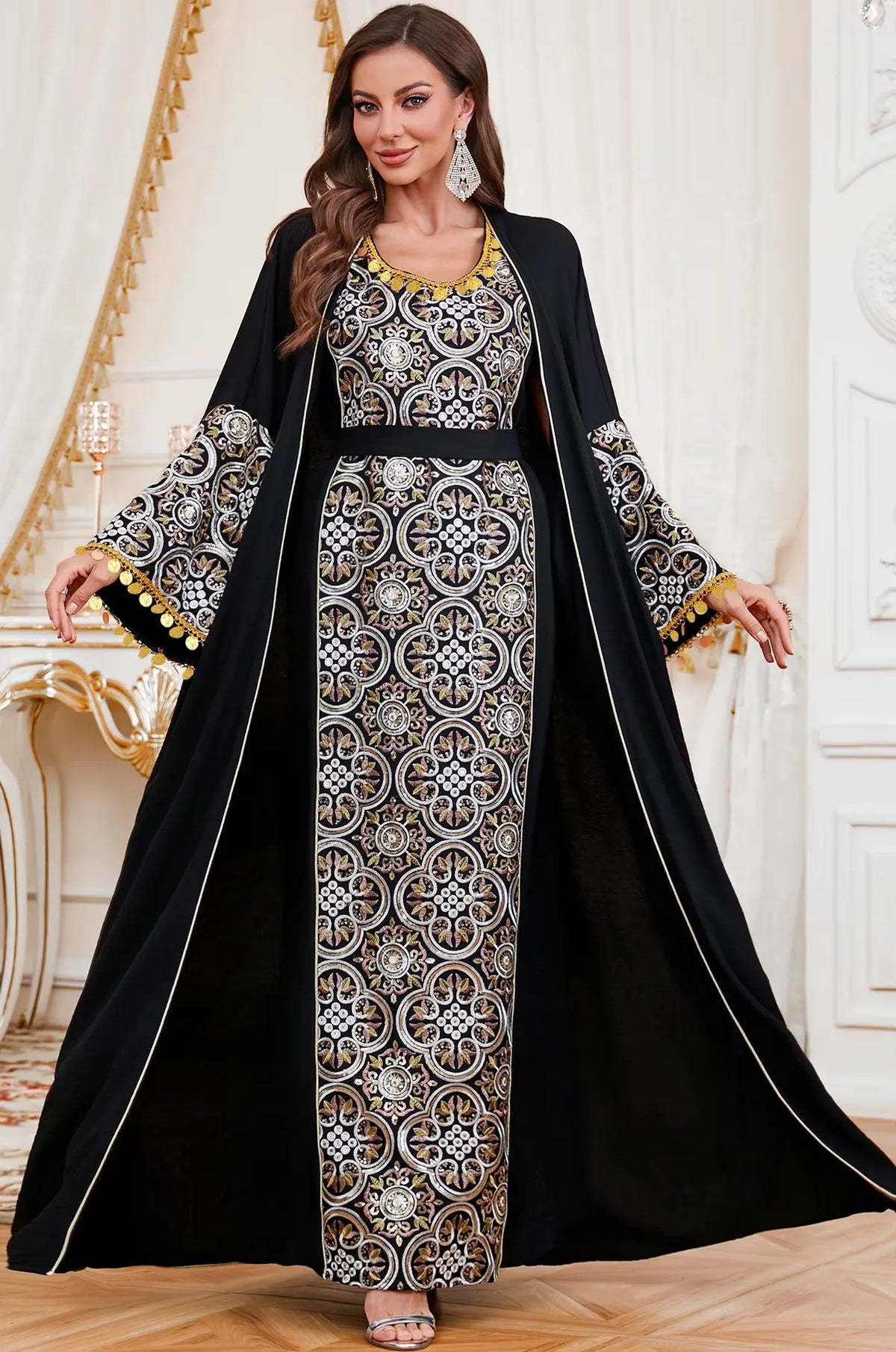 Wide pose of the Black Novae kaftan with flared sleeves open to show the detailed embroidery and coin tassels for formal occasions.