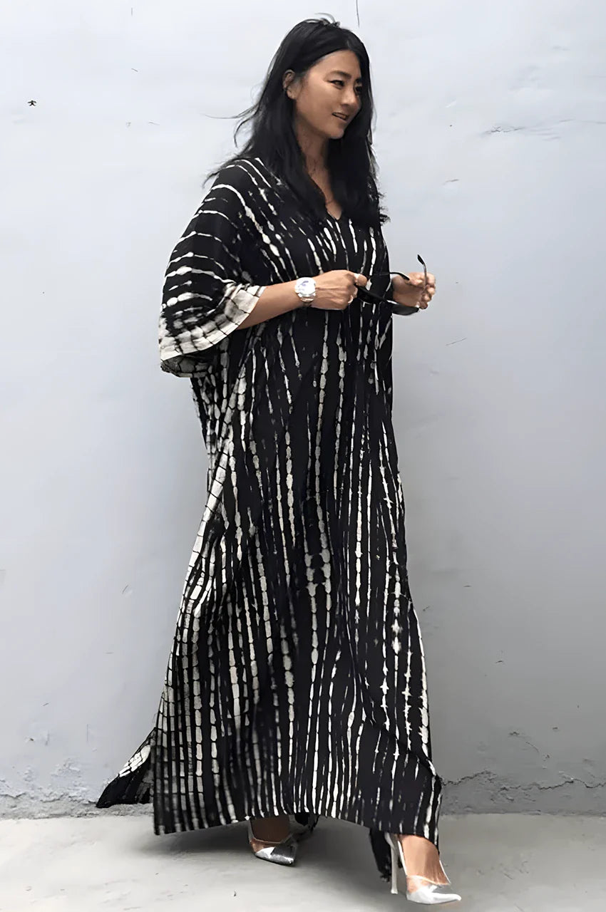 Model walking in Sahra Black Tie Dye Kaftan showing soft flowy movement and chic comfort