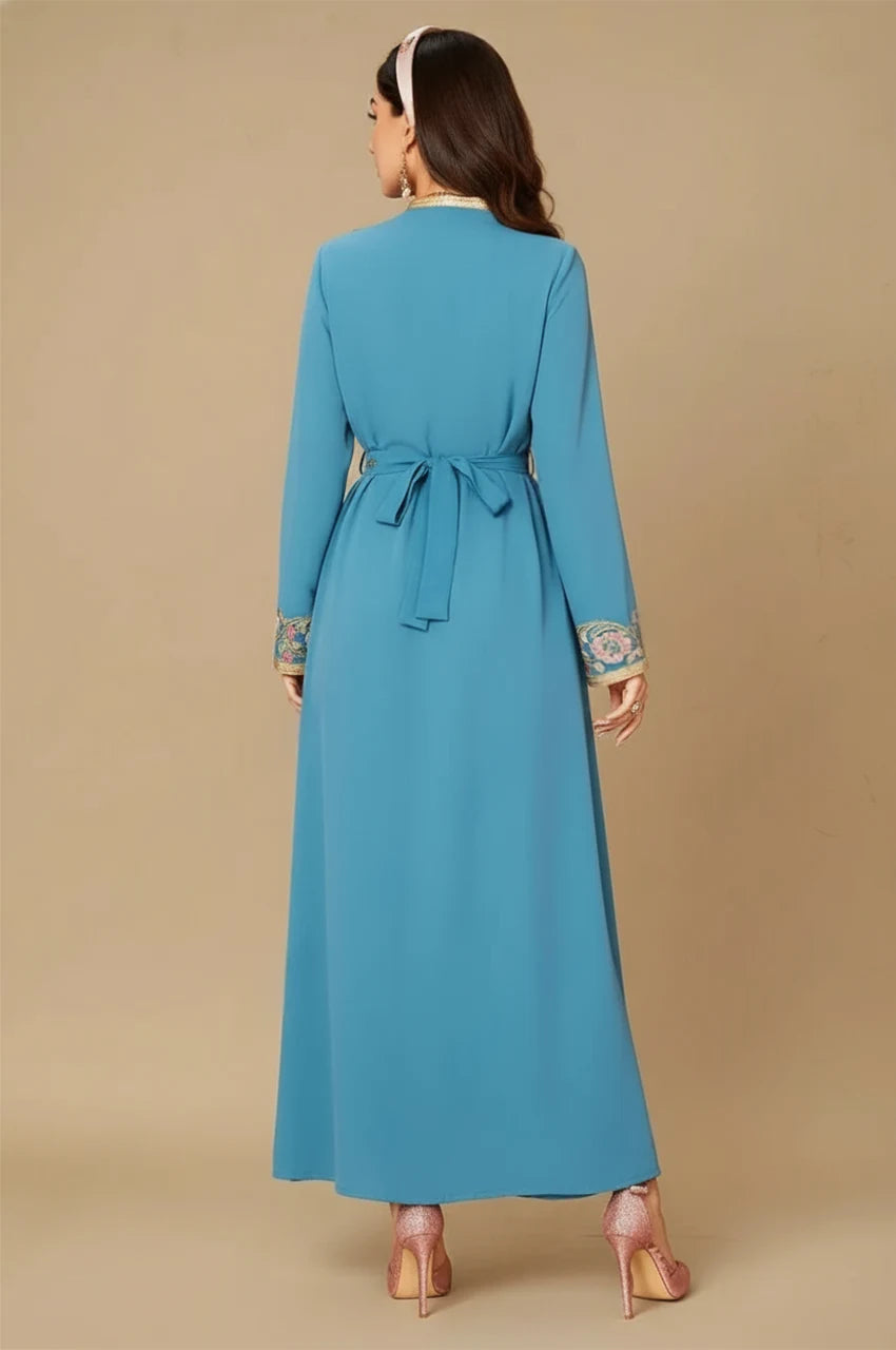 Back view of the blue floral kaftan highlighting the ribbon-style belt closure.
