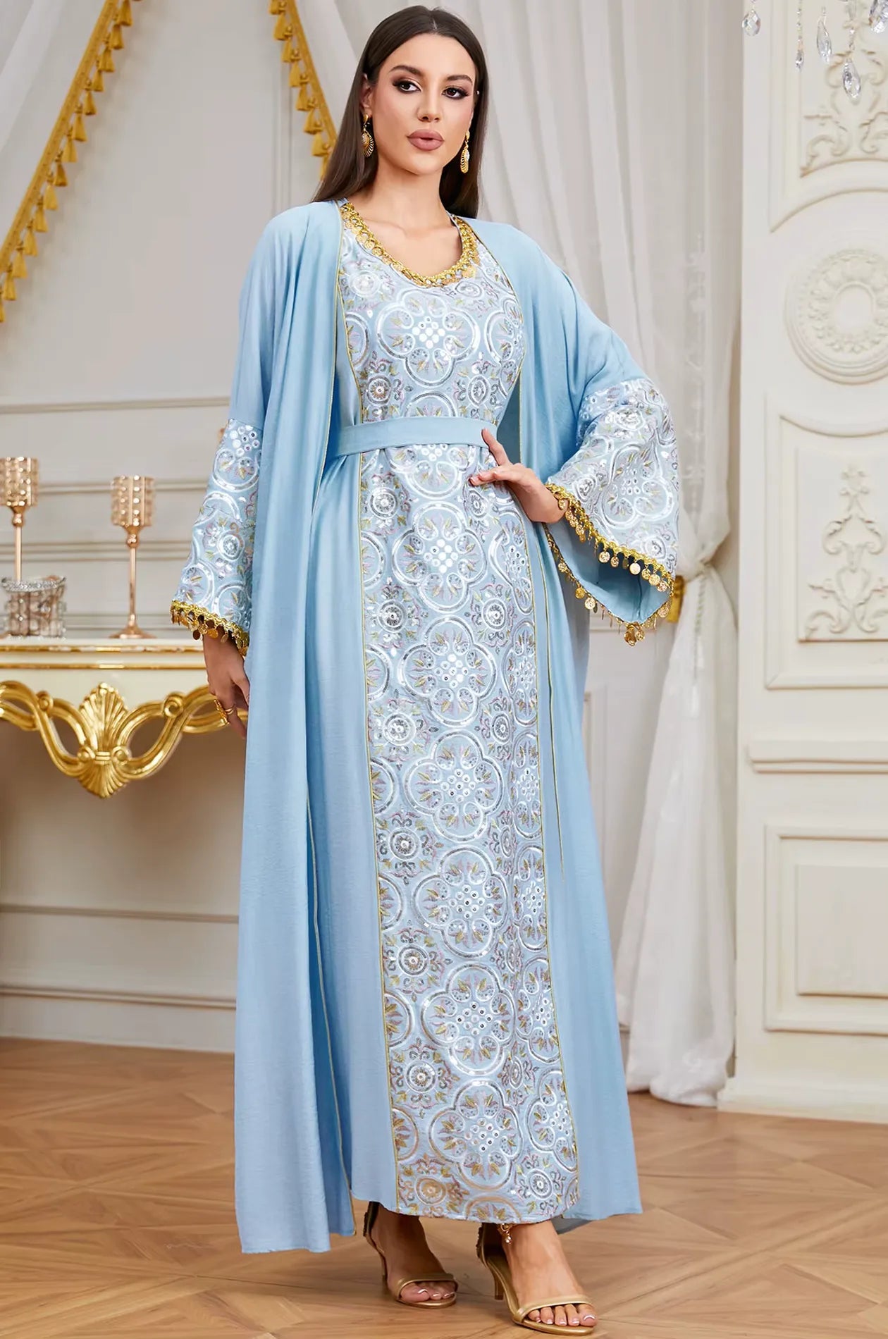 Detailed view of the sky blue Novae crepe kaftan with a matching adjustable belt to define the silhouette.