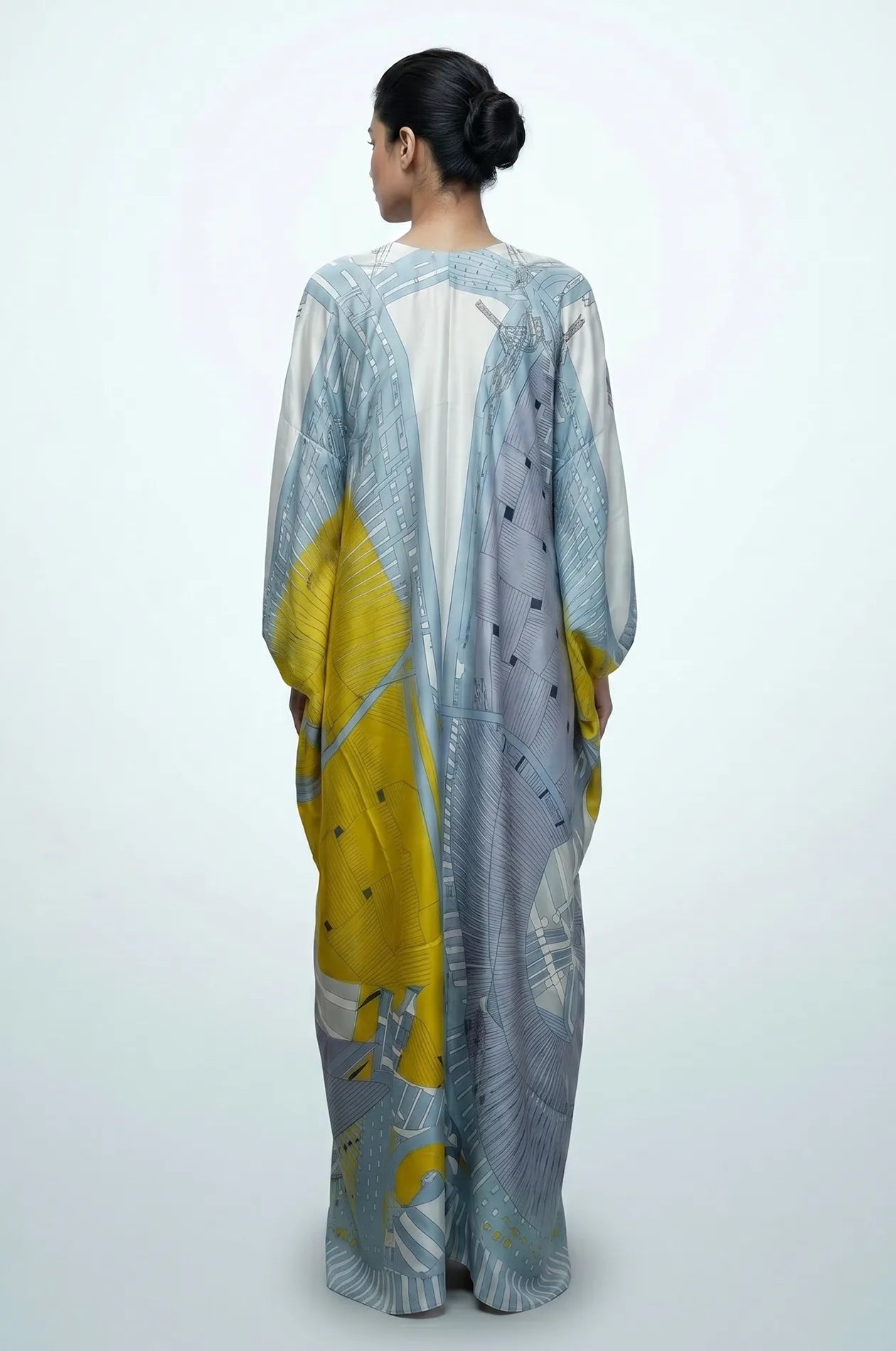 Back view of sky blue silk maxi kaftan with abstract geometric gradient print