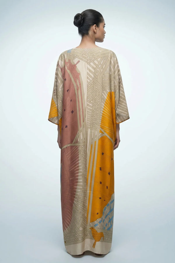 Back view of sage green silk maxi kaftan with abstract geometric print