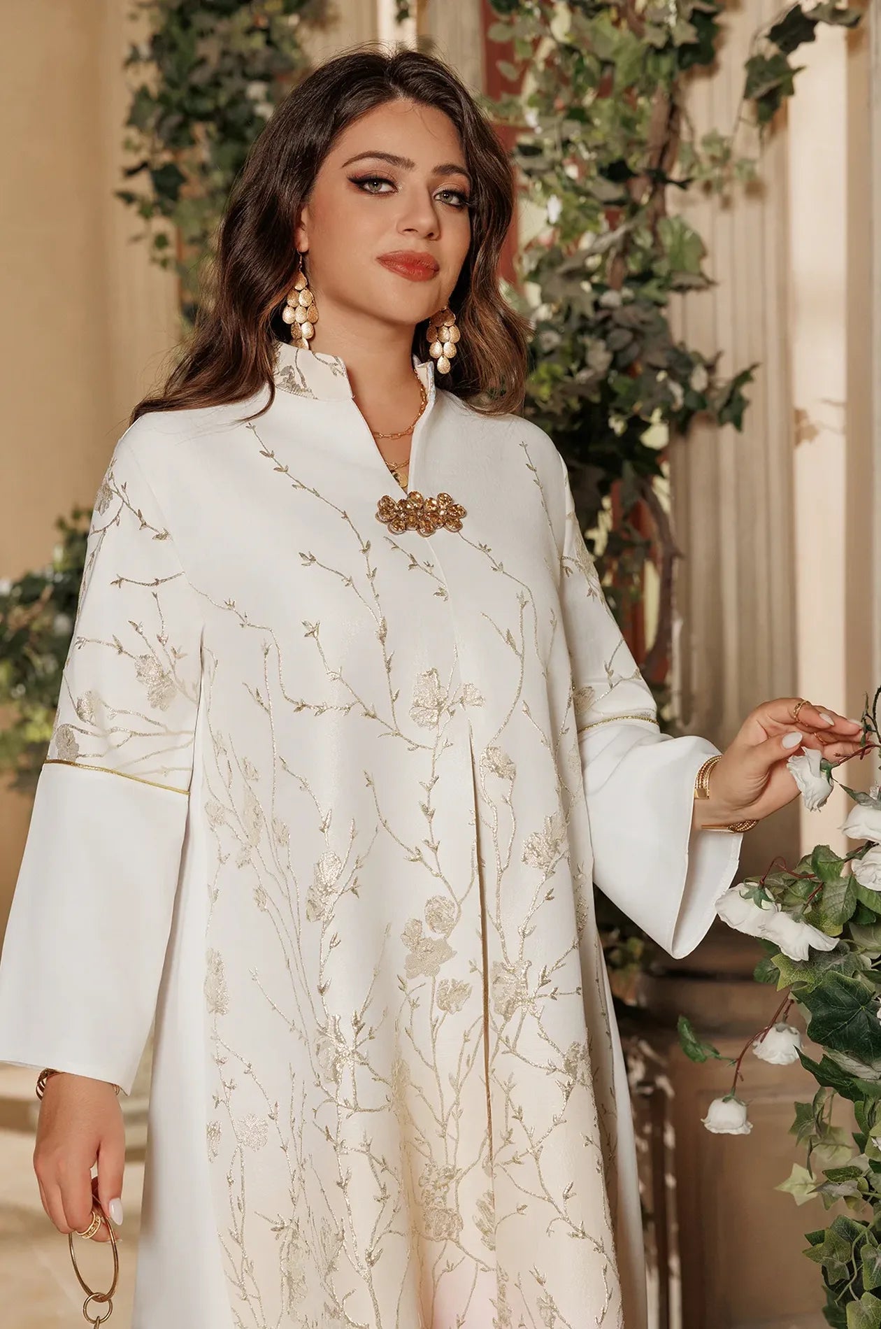 Detailed view of the Tayla Botanical Kaftan in Light Blue showing the intricate silver threadwork on the sleeves and bodice.