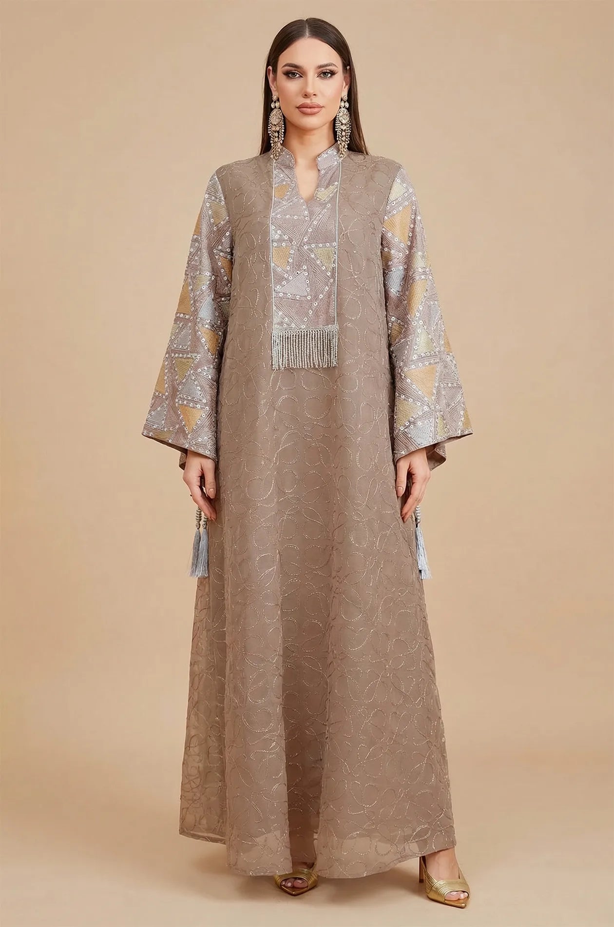 Front view of the Brown Kaliera, a modest geometric kaftan perfect for formal events, showing the V-neckline and silver fringe tassel.