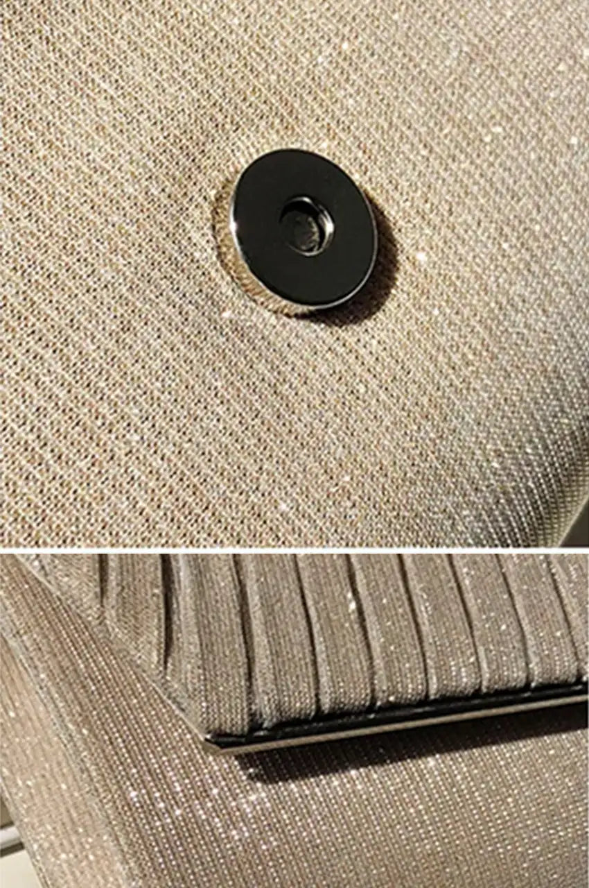Close-up detail shot showing the textured champagne gold shimmer fabric, diagonal pleats, silver metal trim, and secure magnetic snap closure.