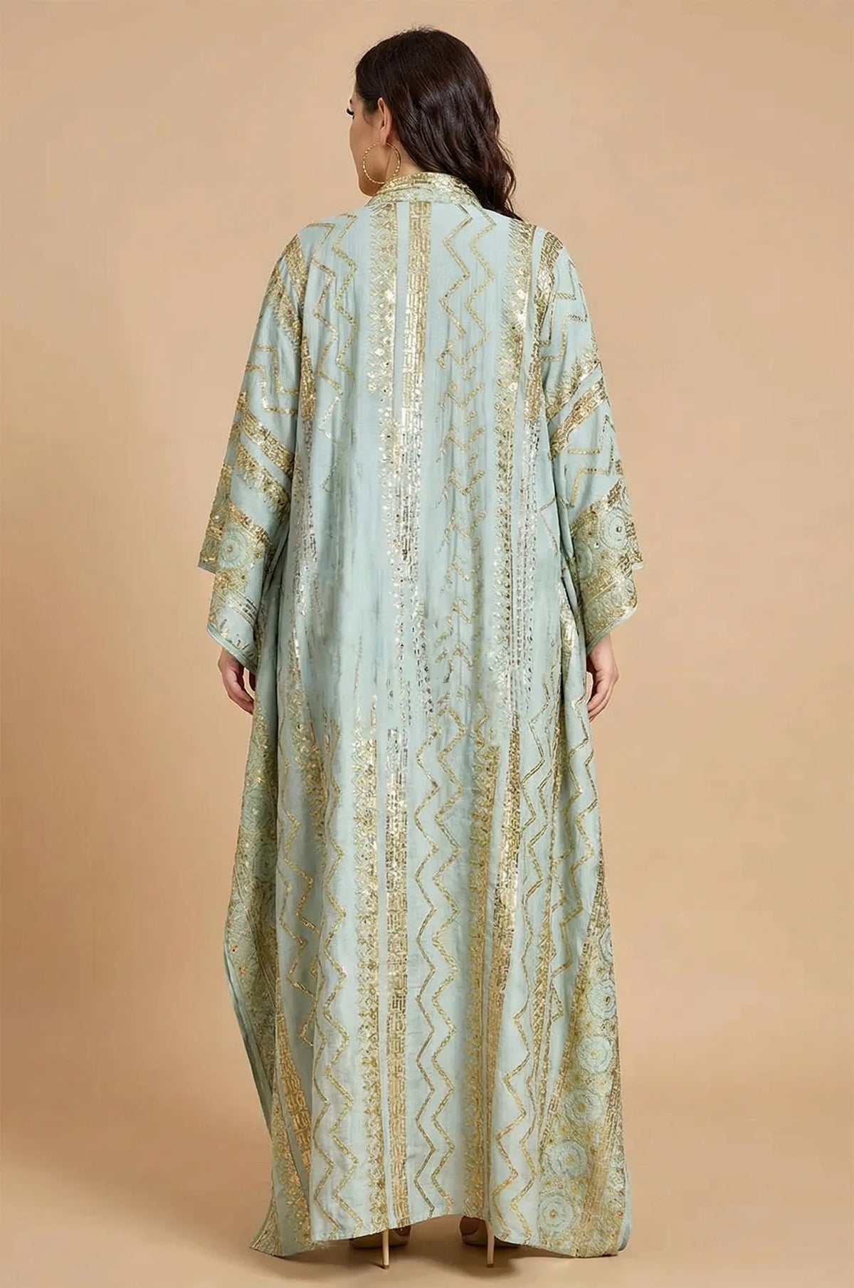 Back view of the Delphin light green kaftan showing the flowy silhouette and back detailing.