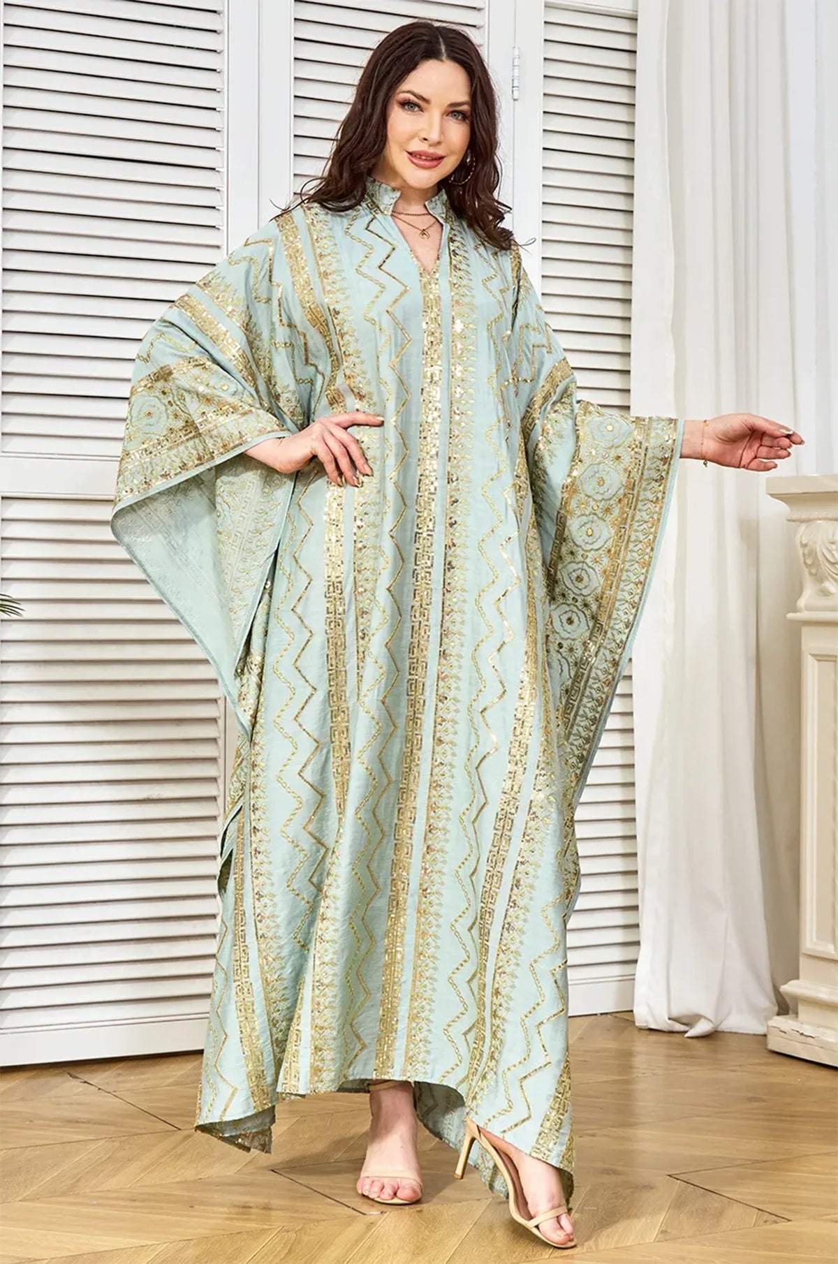 Full-length pose of the light green Delphin kaftan for formal party wear.