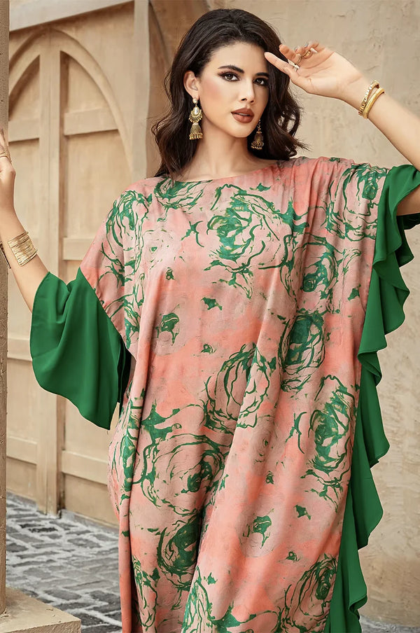 Close-up of green floral prints on Elara beige kaftan