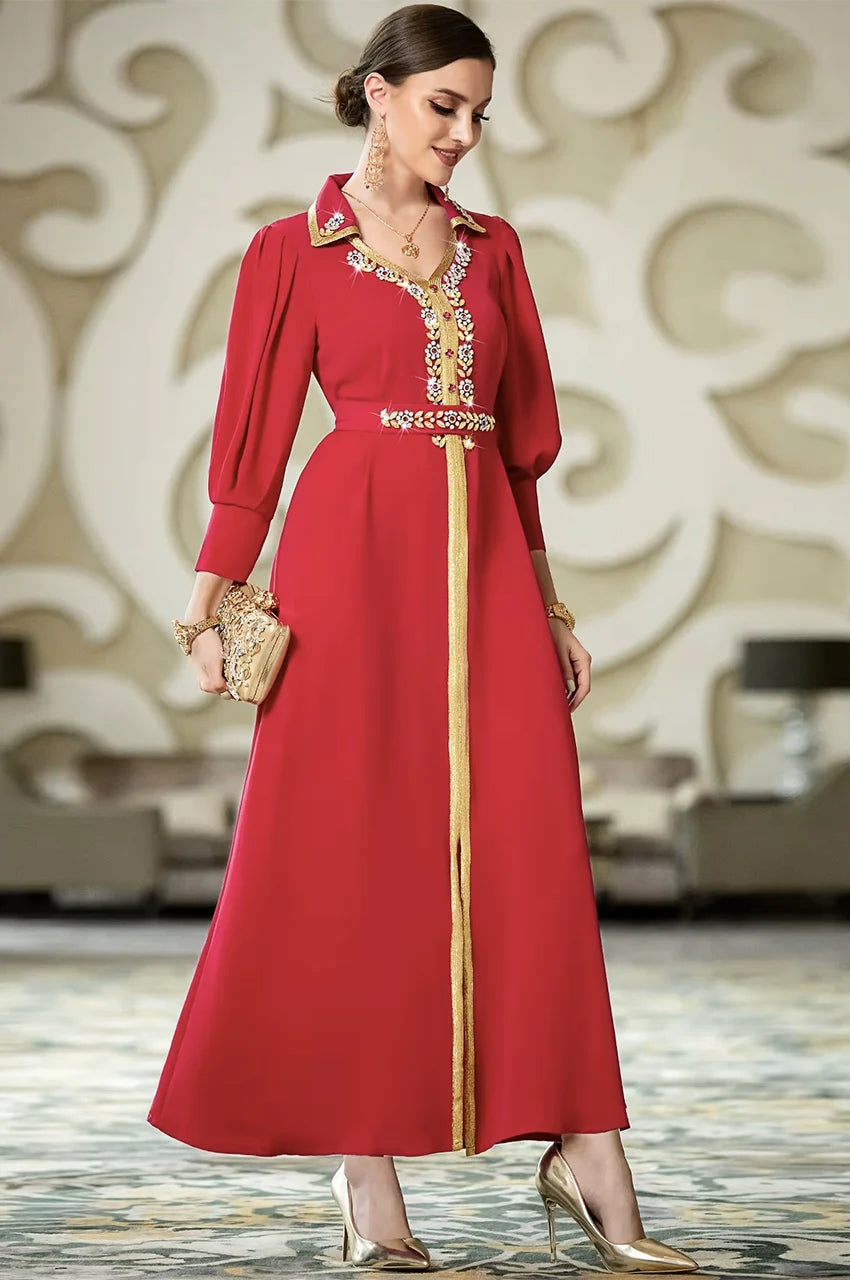 Elegant red Takchita style kaftan dress by Naylara featuring structured shoulders and gold artisan details.