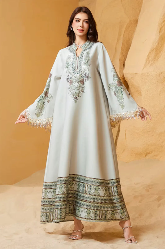 Editorial shot of Eliah off white kaftan in a desert setting.