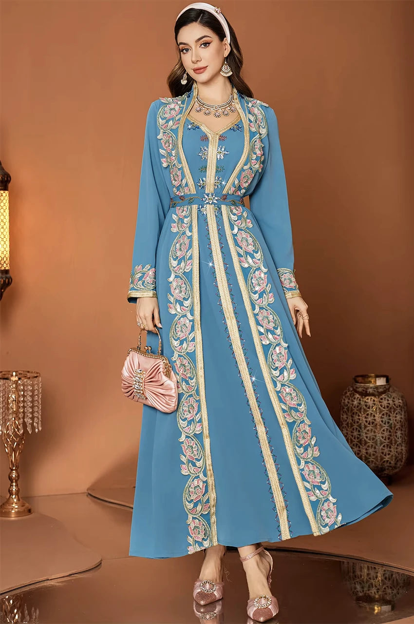 Front view of Elina blue floral kaftan dress featuring gold Sfifa trim and flared silhouette.