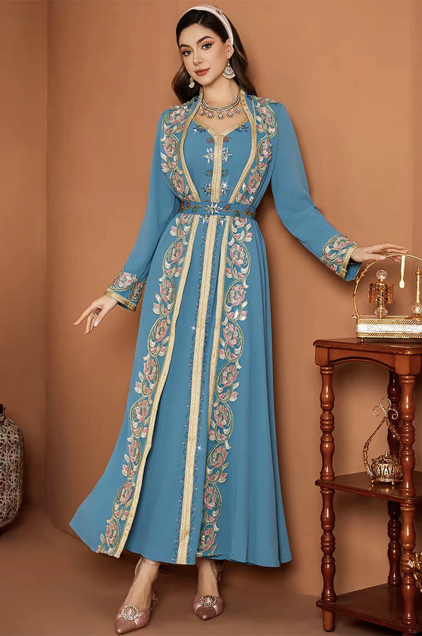 Full-length standing view of the Elina blue floral kaftan for wedding guest inspiration.