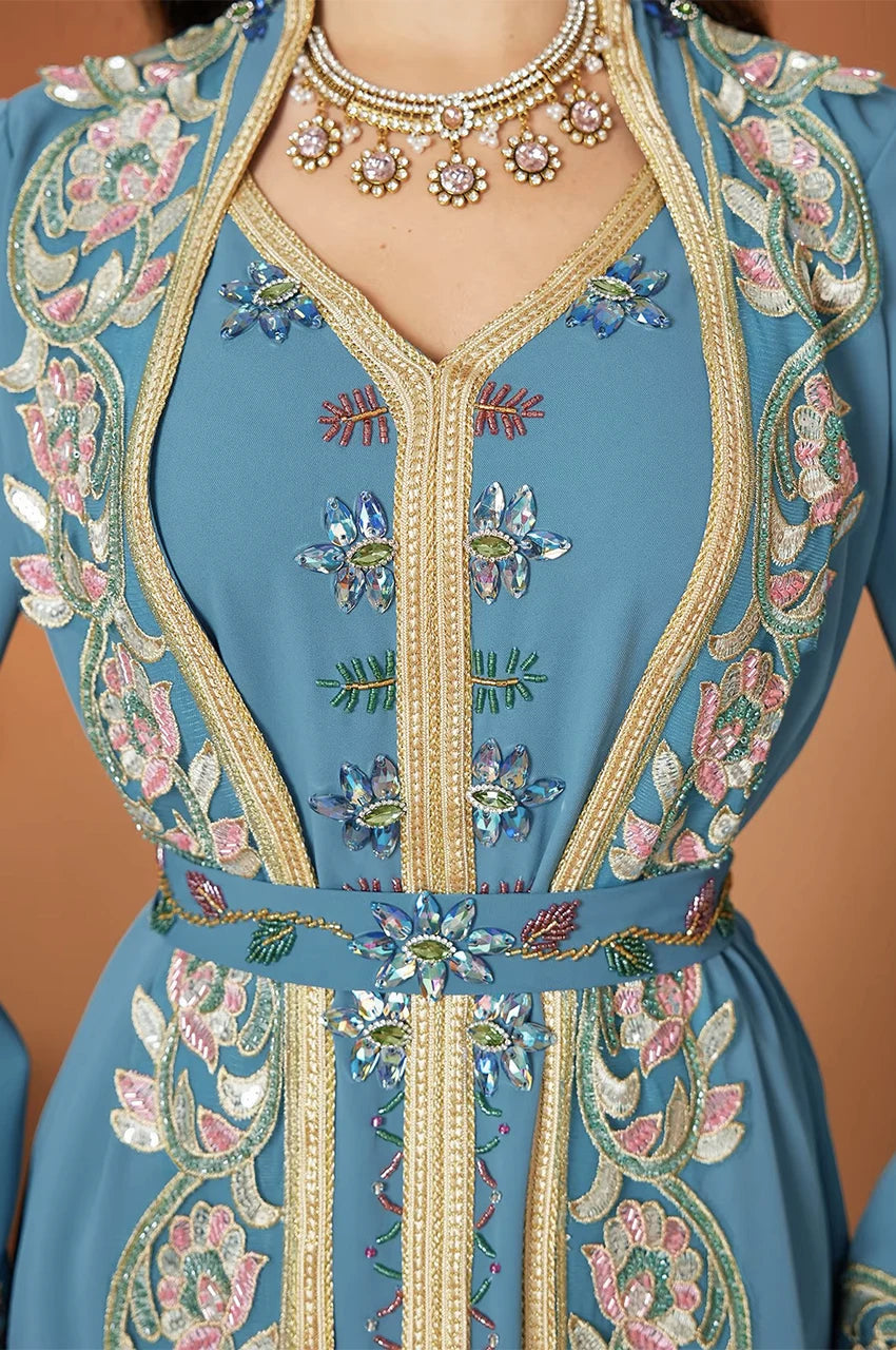 Close-up of neckline and embroidery on Elina blue kaftan