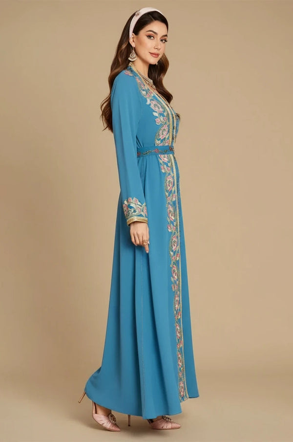 Studio profile of the Elina blue floral kaftan demonstrating the high-end tailored fit.