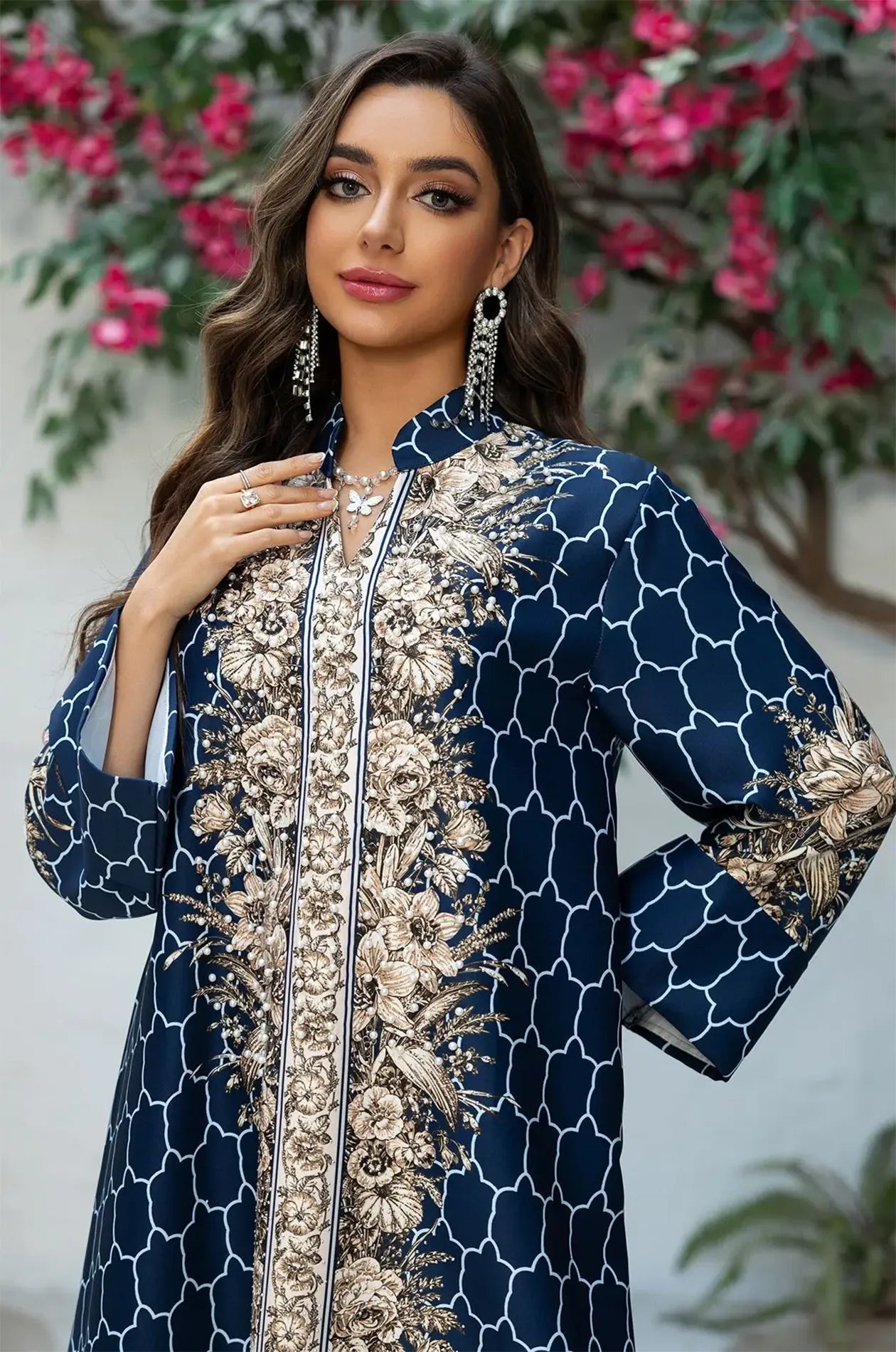 Macro detail of the high-neck Mandarin collar and the rhinestone-accented floral motifs on the Royal Blue Elora kaftan.