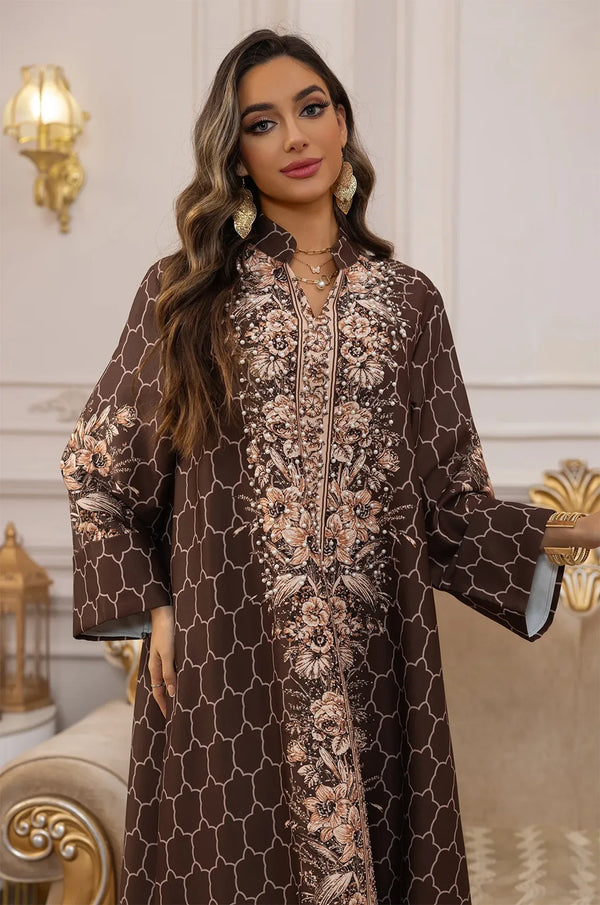 Close-up of the high-neck Mandarin collar and intricate copper floral embroidery on the Elora Brown kaftan.