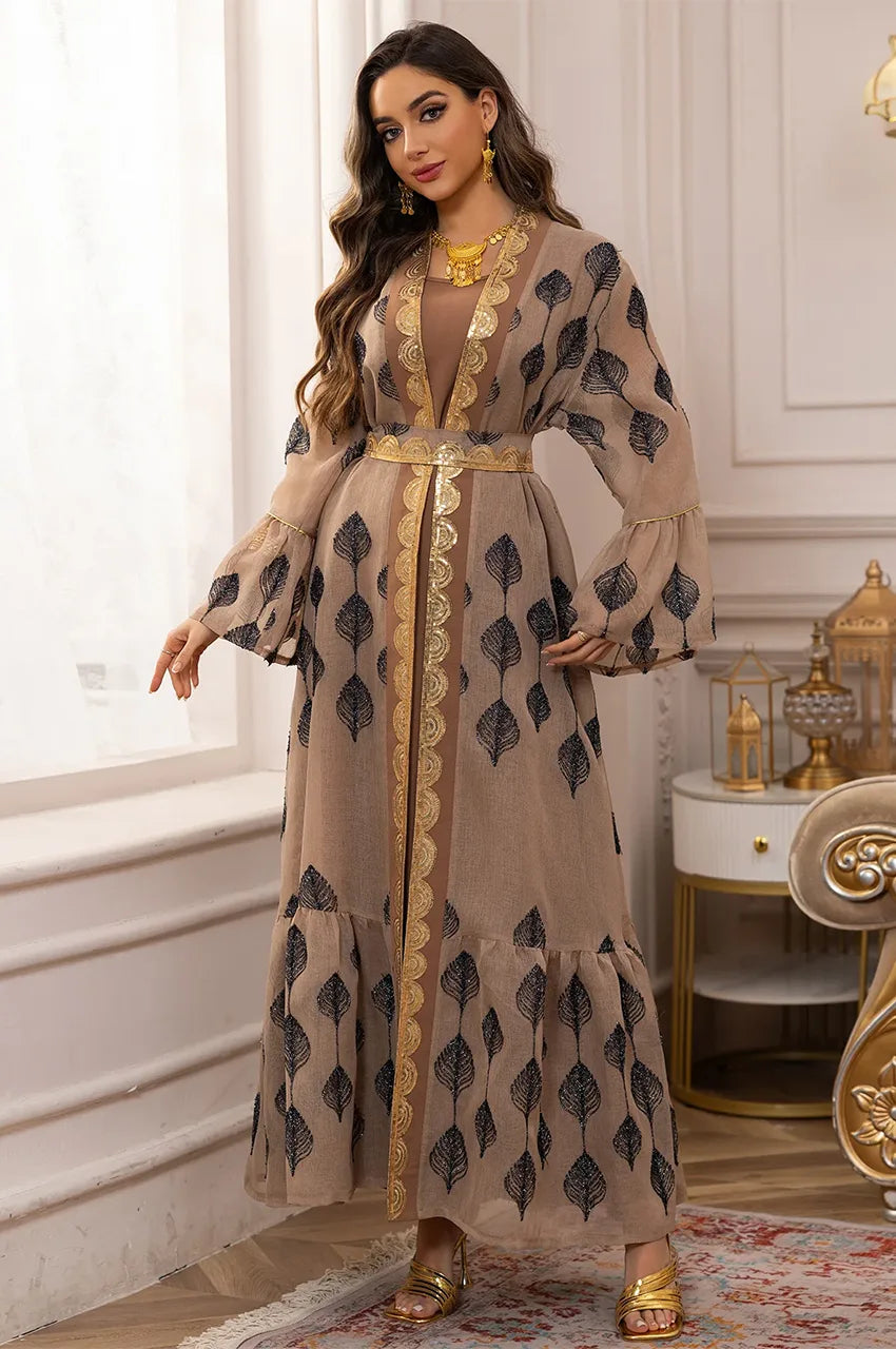 Wide bell sleeves with gold Sfifa trim on the ELSIA khaki kaftan edition.
