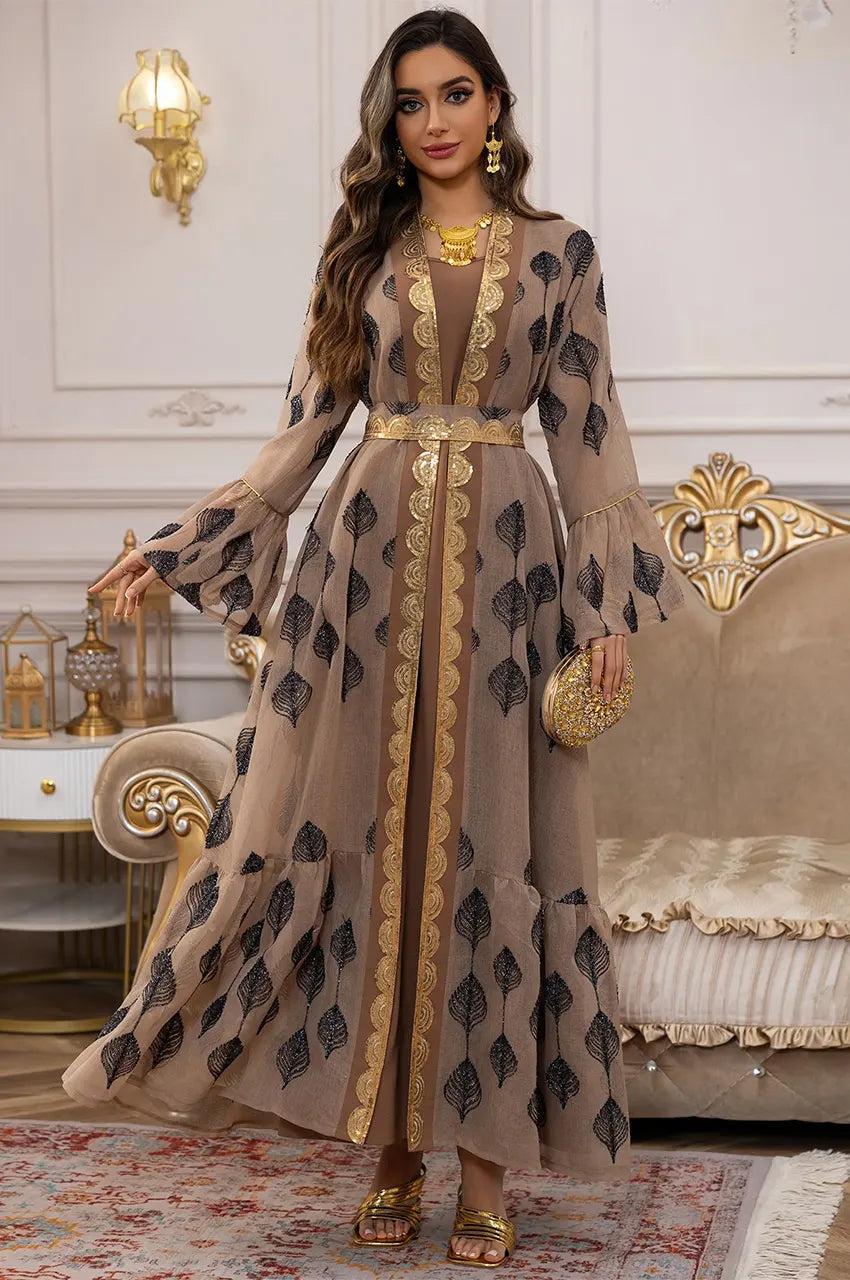 The khaki kaftan styled with a cinched waist using the adjustable gold metallic belt.