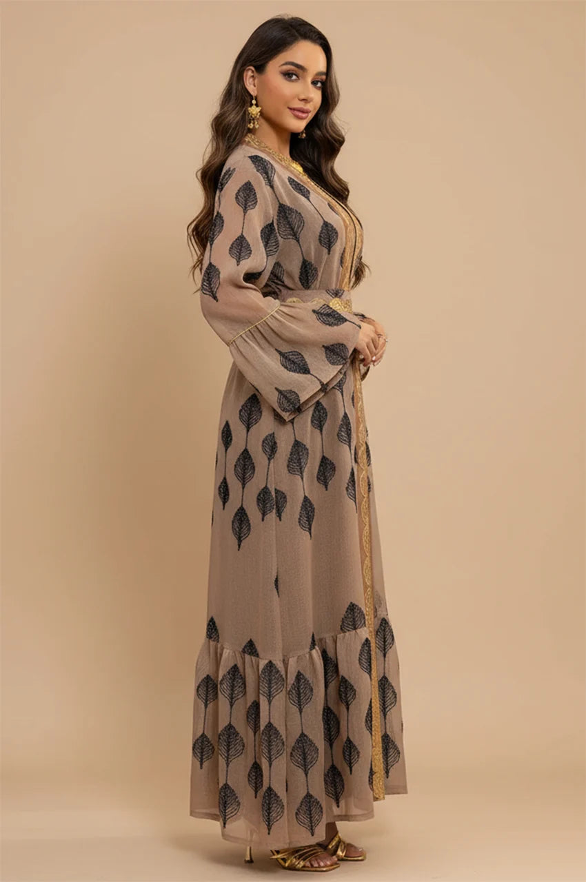 Side profile of the khaki kaftan highlighting the non-restrictive fit and layered construction.