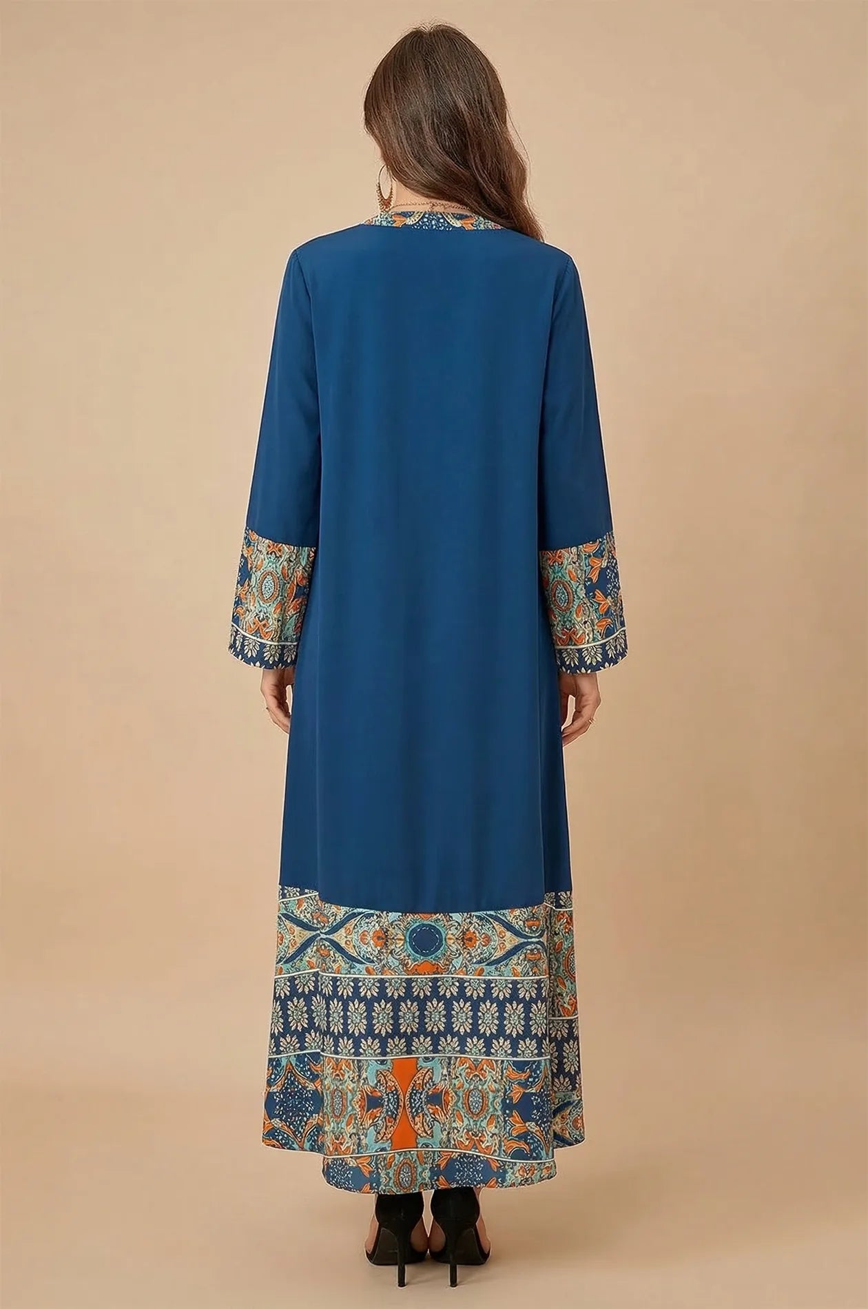 Full-length back view of Elyah indigo kaftan showing relaxed fit and printed hem
