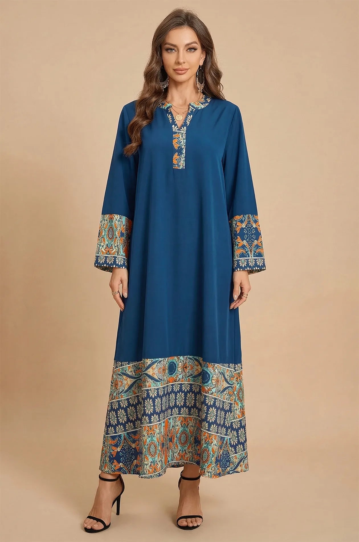 Front view of Elyah indigo kaftan with orange floral print borders at Naylara