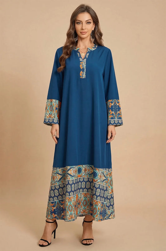 Front view of Elyah indigo kaftan with orange floral print borders at Naylara