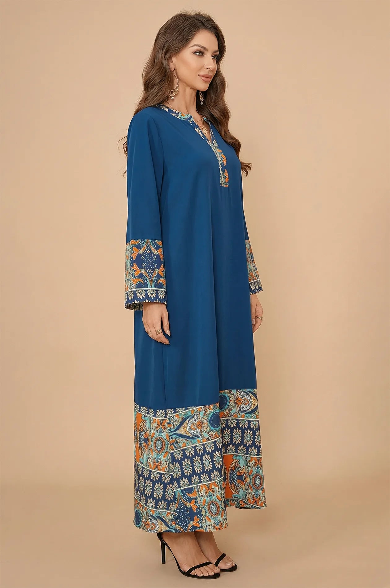 Side profile of Elyah indigo kaftan highlighting the sleeve print detail