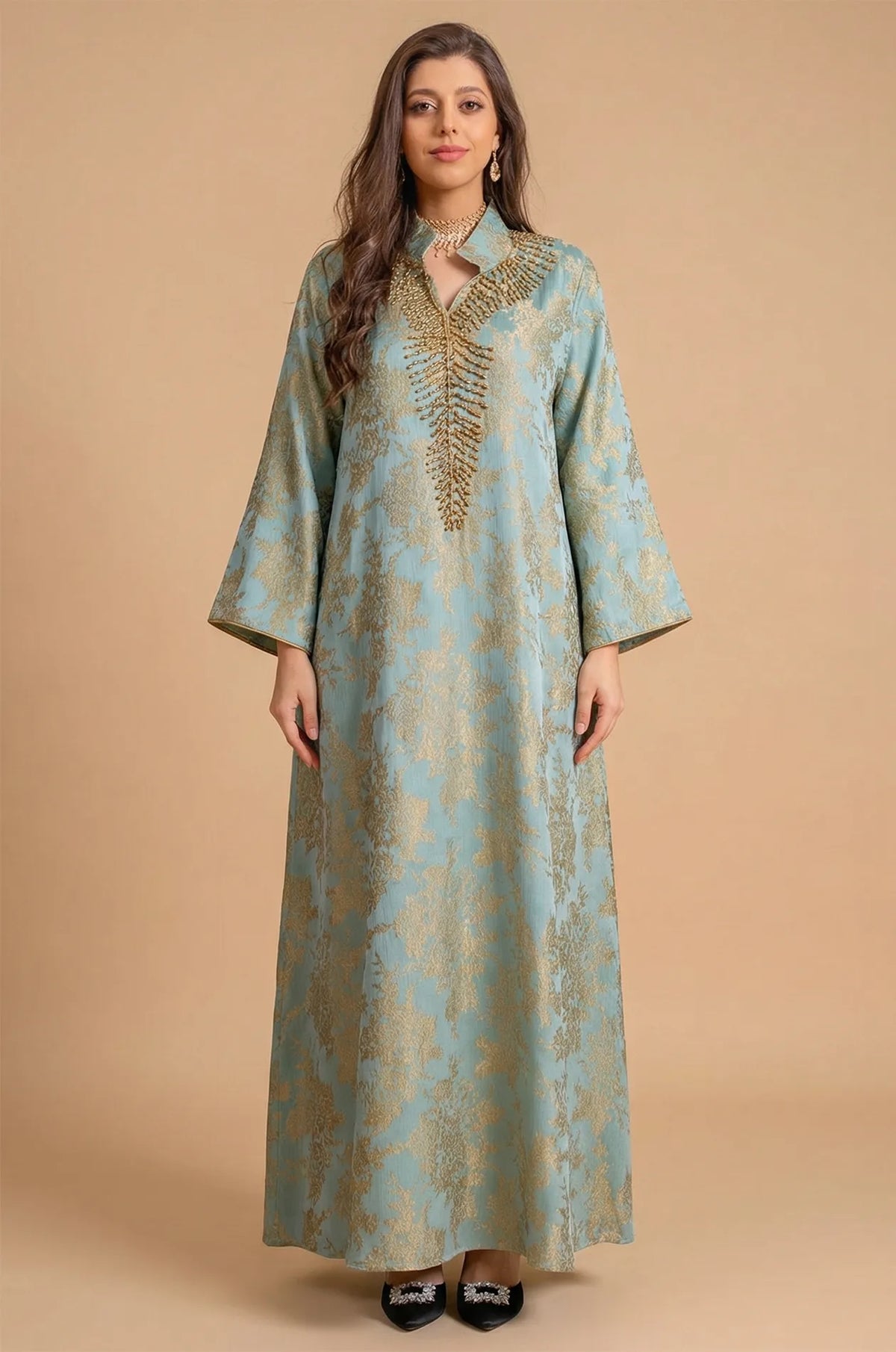 Full-length front view of the Estel light blue jacquard kaftan with gold floral patterns on a neutral beige studio background.