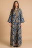 Full-length front view of the Estel navy blue jacquard kaftan with gold floral patterns on a solid beige studio background.