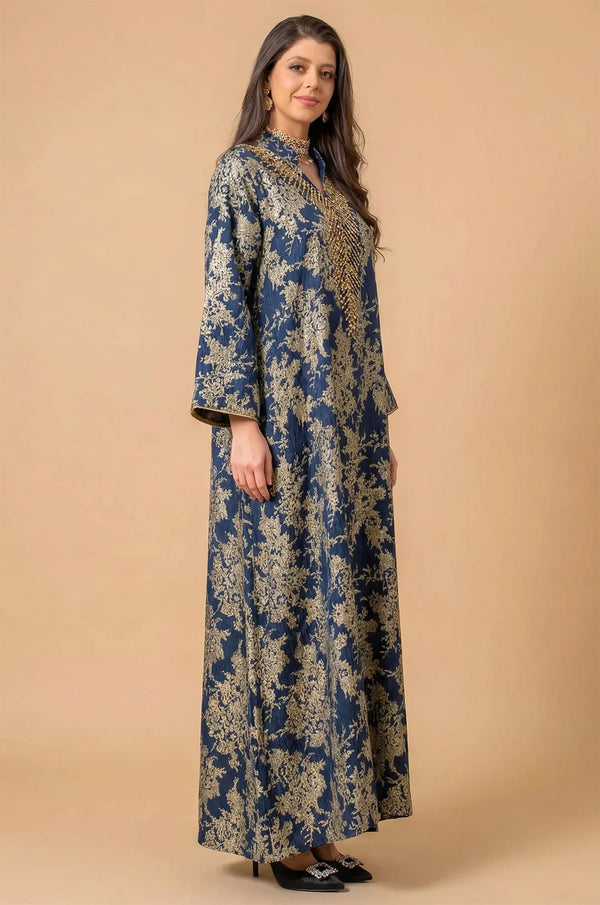 Side three-quarter profile of the Estel navy blue kaftan showing the elegant drape of the fabric against a neutral background.