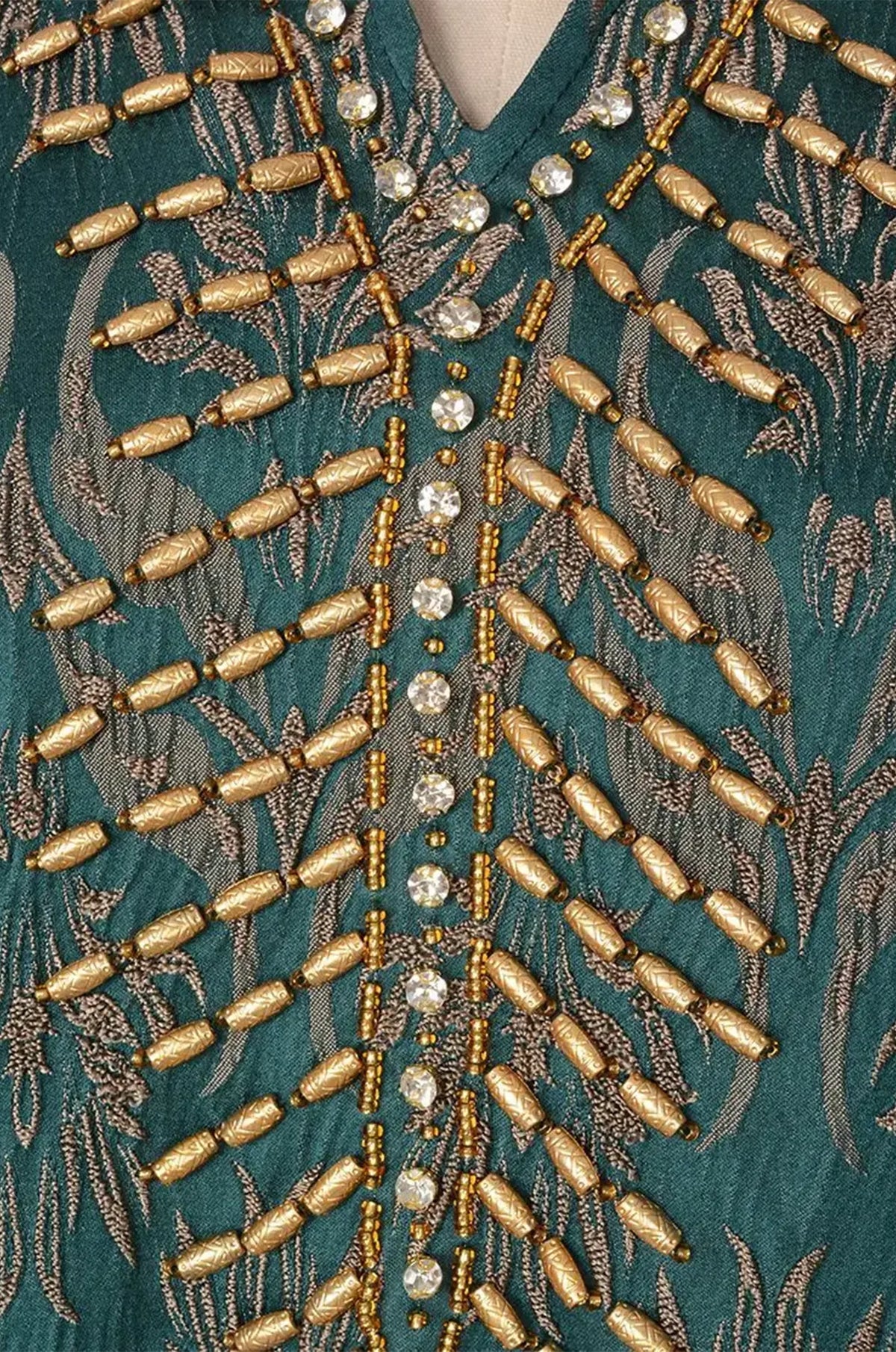 Close-up detail of the hand-beaded gold and rhinestone neckline on the Farah kaftan.