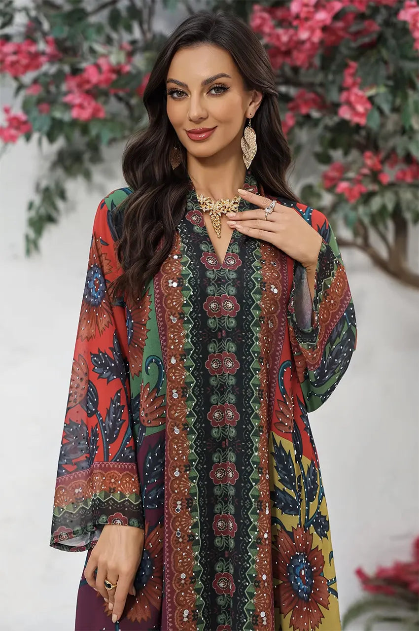 Detailed view of the Fariya kaftan bodice styled with a gold statement necklace.